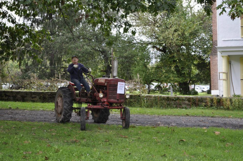 Pete Choate riding the tractor