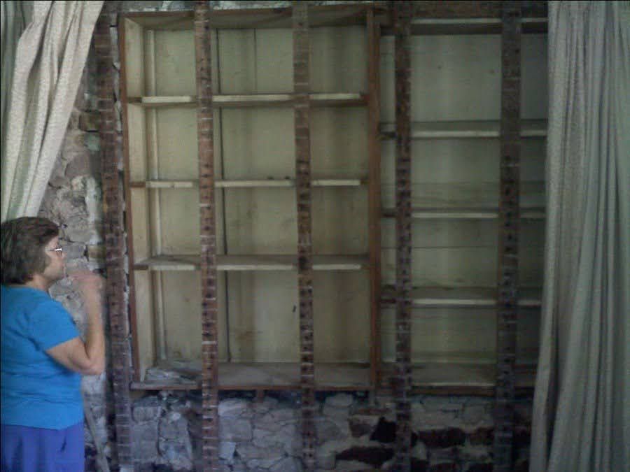 margaret choate pointing out exterior wall that had been hidden