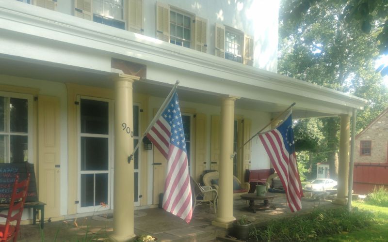 Picture of the front porch at Penrose-Strawbridge Farm.