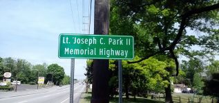 A signpost for the Lt. Joseph C. Park II Memorial Highway