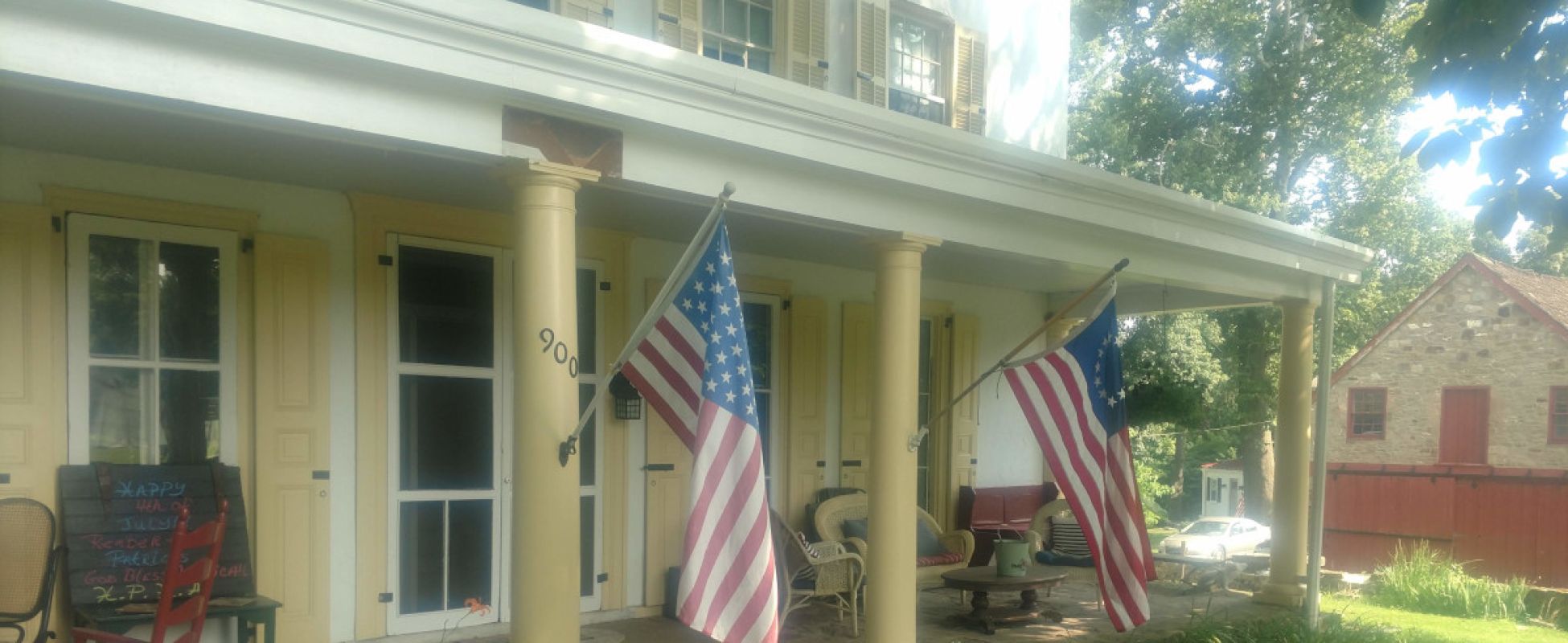 Picture of the front porch at Penrose-Strawbridge Farm.