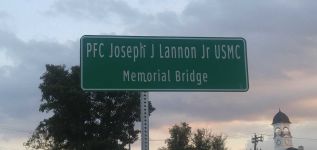 A signpost of the PFC Joseph J. Lannon Jr. USMC Memorial Bridge