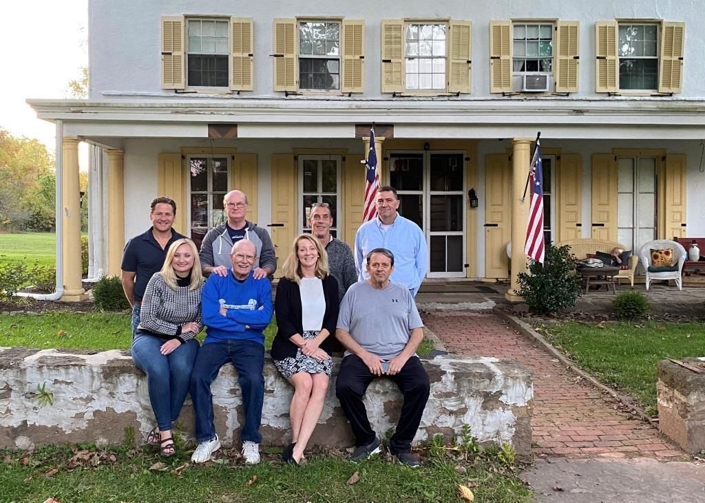 Group shot of the board of directors outside at Penrose-Strawbridge Farm.