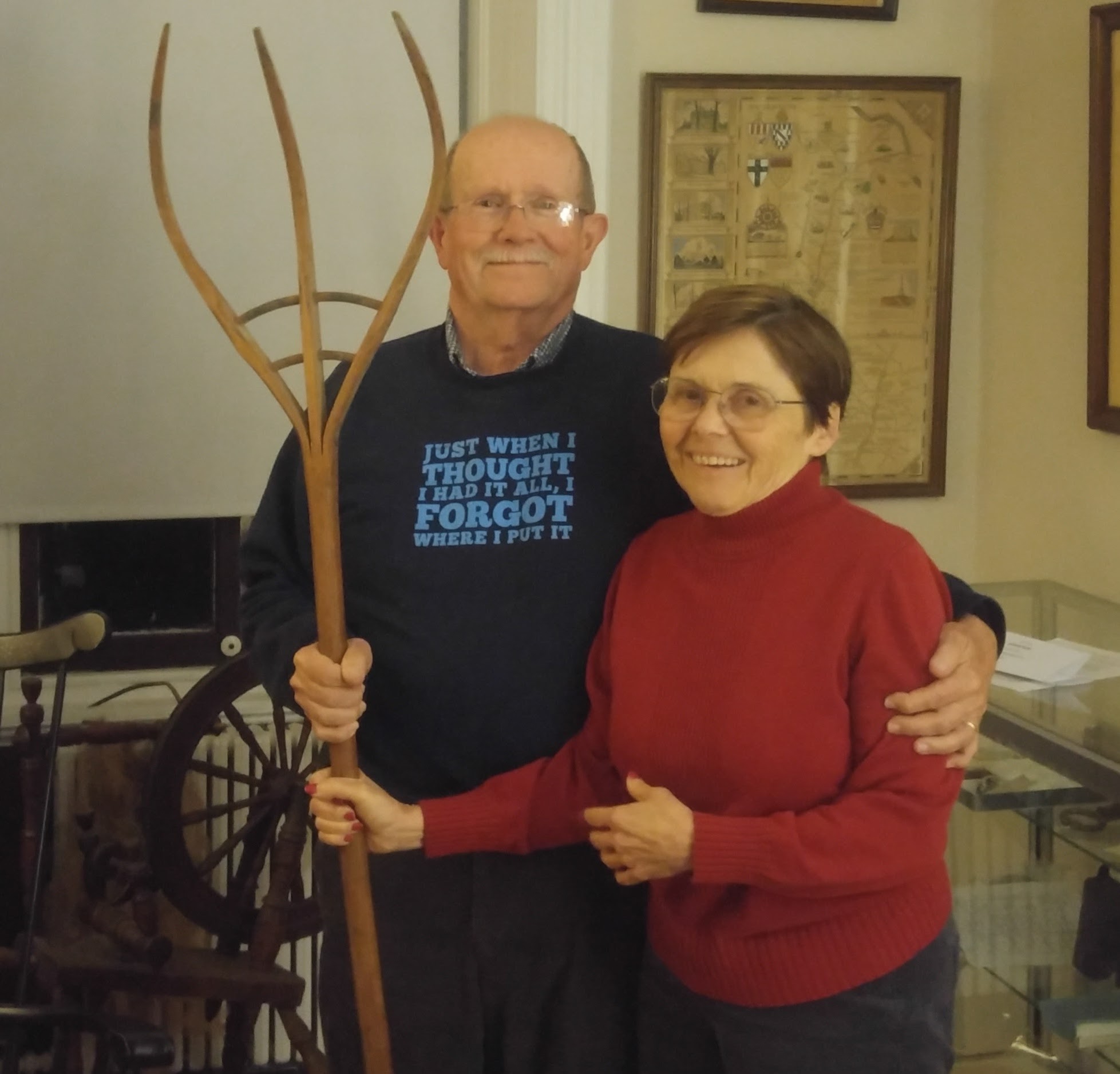 photo of pete and margaret choate with antique wooden pitchfork