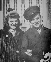 photo of Al Schmid in marine uniform and wife Ruth Hartley wearing a mink