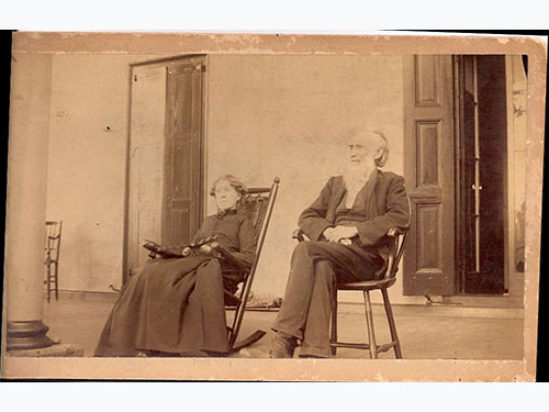 photo of Abel and Sara Penrose c1875-1893 on rocking chairs on porch