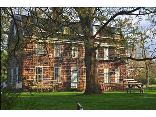 photo of west side of Keith House with large tree