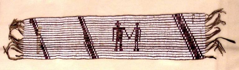 photo of wampum belt depicting 2 people holding hands