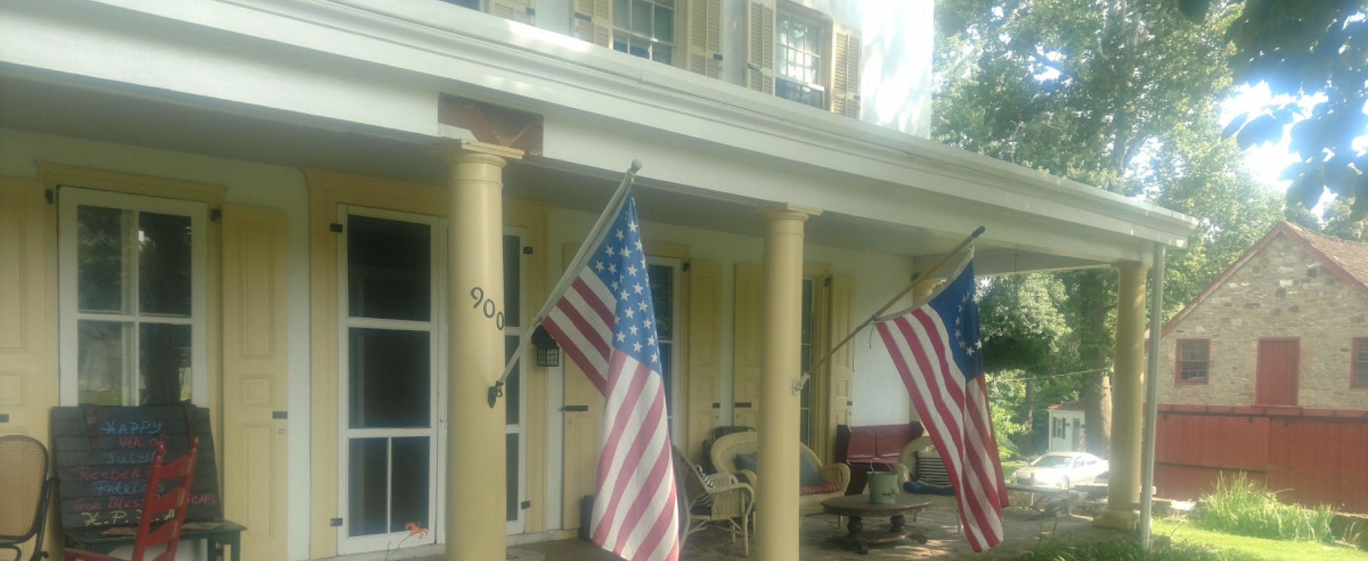 Picture of the front porch at Penrose-Strawbridge Farm.
